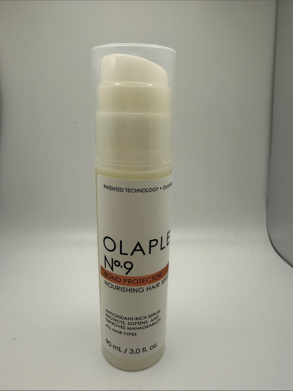 OLAPLEX No.9 Nourishing Hair Serum — White with Orange Accent